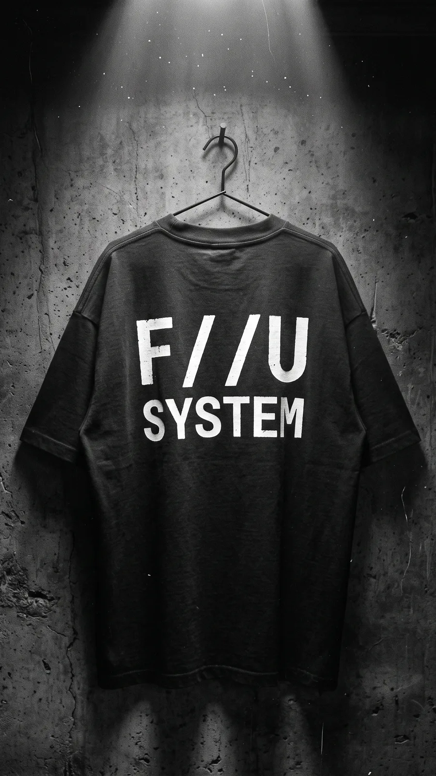 F//U SYSTEM tee hanging under a single beam of light